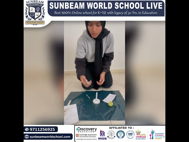 Afreen grade 7 showcasing captivating experiment on the visibility of lemon on paper using a candle.