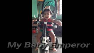 baby talking while riding by cycle