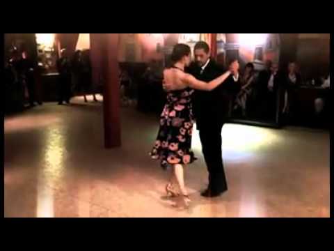  Adrian Costa  and  Amanda Costa  are  dancing  to  the  tango  "  Toda Mi Vida  "