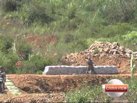 Officer saves soldier from live grenade in S China