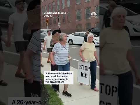 Protesters hold a vigil for the victim of the ICE shooting in Maine