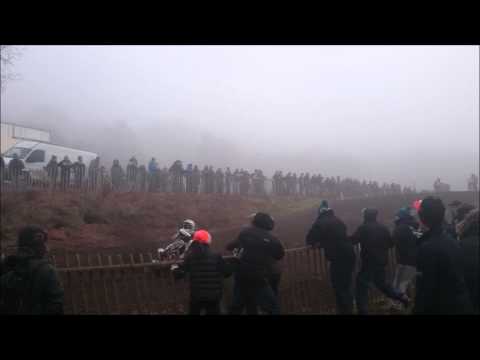 Motocross rider crashes through fence into crowd