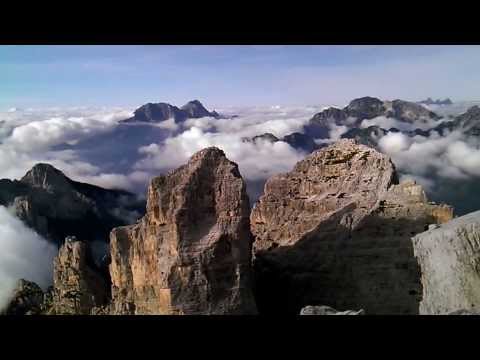the World over the clouds from the top of Sasso di Bosconero