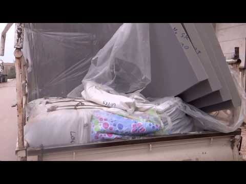 توزيع المعونات الإغاثية في القصير في محافظة حمص من قبل وحدة تنسيق الدعم