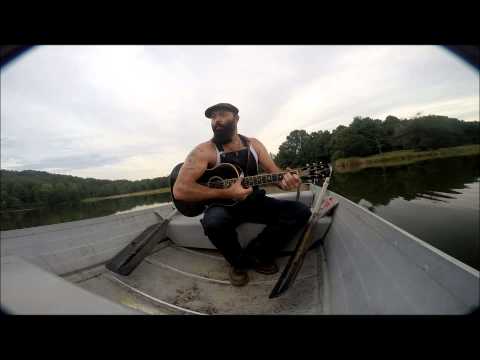 Front Porch Sessions: Rev. Peyton performs amazing finger style guitar tricks on a boat.