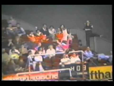 Uneven bars. Dismount salto bwd with 1/1 twist