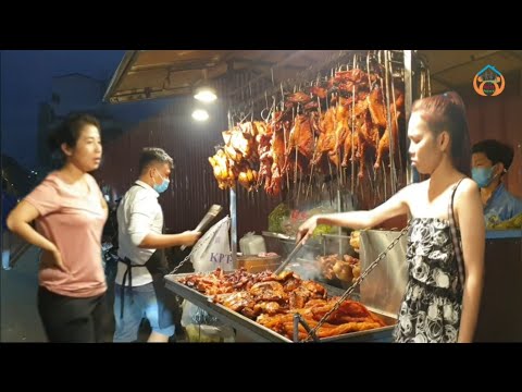 Grilled chicken, grilled pork, grilled duck, grilled quail,  look delicious, sold behind Wat Ounalom