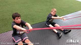 Elite Youth Athletes working to improve their rowing technique with band rows
