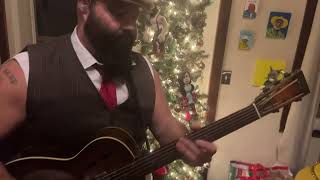 Rev. Peyton plays Silent Night and Jingle bells on the old National guitar