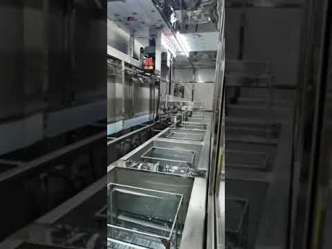 Multi Stage Ultrasonic Cleaning System with Single Robotic Arm
