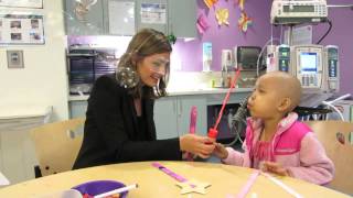 Stana Katic of ABC's Castle Blows Bubbles with Little Girl at Children's Hospital Los Angeles