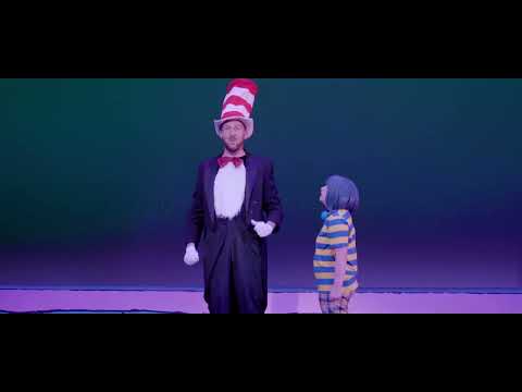 Trailer close-up: Gertrude reaching toward Horton as lights warm to gold