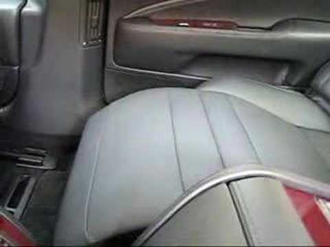 001 demonstrates the rear reclining seat with ottoman on the new Lexus LS