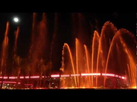Epcot's Fountain of Nations in Slow Motion, with a Full Moon in the Sky