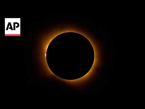 People around the world gather to witness solar eclipse