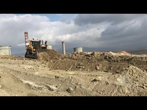 Caterpillar D9T And Komatsu D275AX Bulldozers Ripping And Pushing