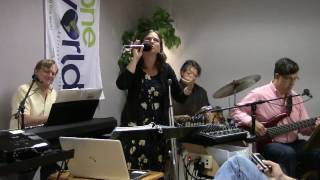 "I Won't Give Up" by Jason Mraz - performed by Asha Lightbearer and the One World Band