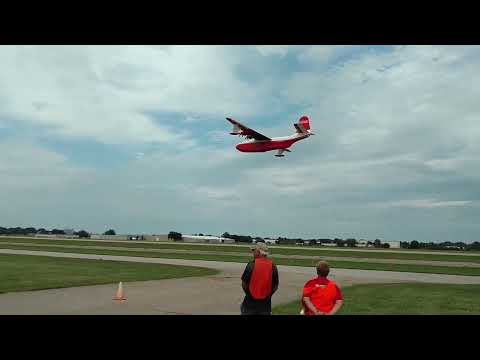 Martin Mars dropping water on a fire. Oshkosh 2016.  It is amazing to see how much water is dropped