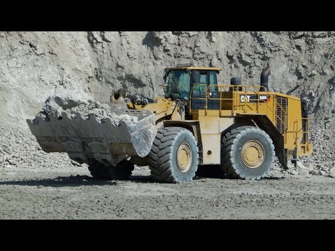 MASSIVE Caterpillar 988K wheelloader loads 775G trucks