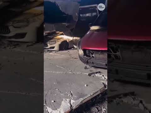 Parking garage partially collapses after car fire. See terrifying video.
