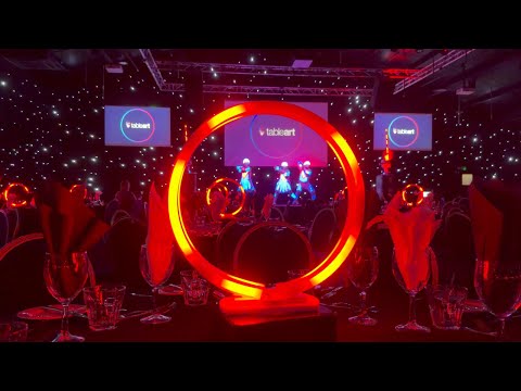 Neon rings and LED dancers synchronised to music at a corporate awards ceremony