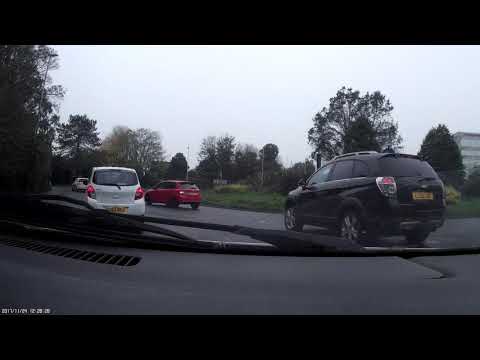 Police car pulls out onto roundabout