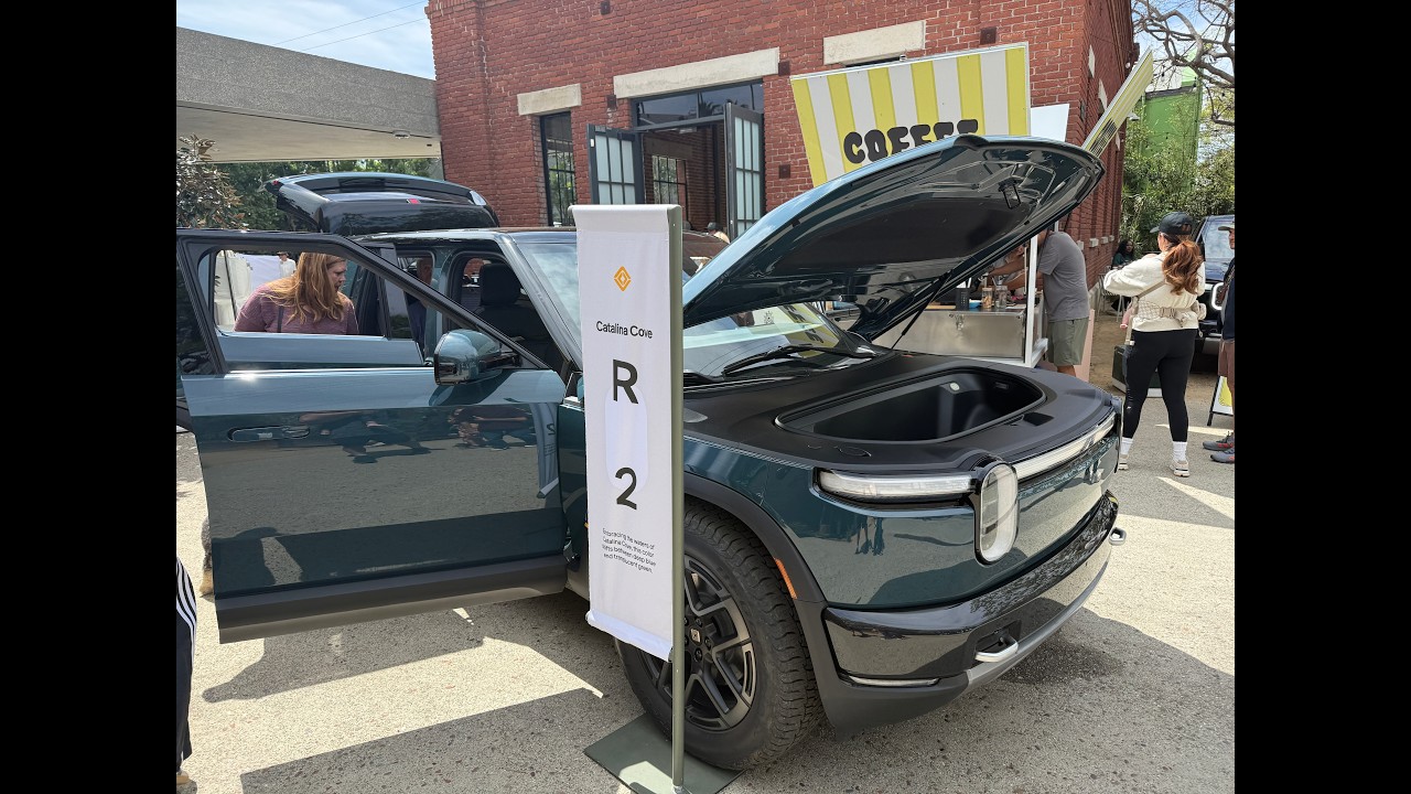 True_Dad and family at the Venice Rivian Space R2 block party, checking out the five display R2s in different colors ahead of customer deliveries