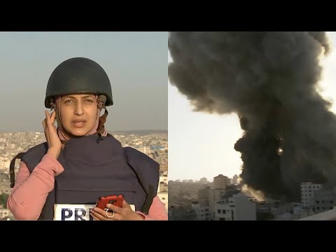 Al Jazeera journalist reports live as building hit by Israel airstrike