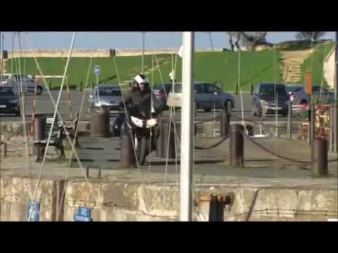 Motorcycle crashes into a yacht.