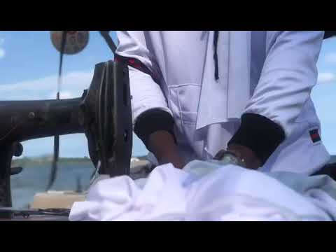 the story of freedom beach entebe Uganda designer latif madoi sewing on the boat dj king Shango (1)