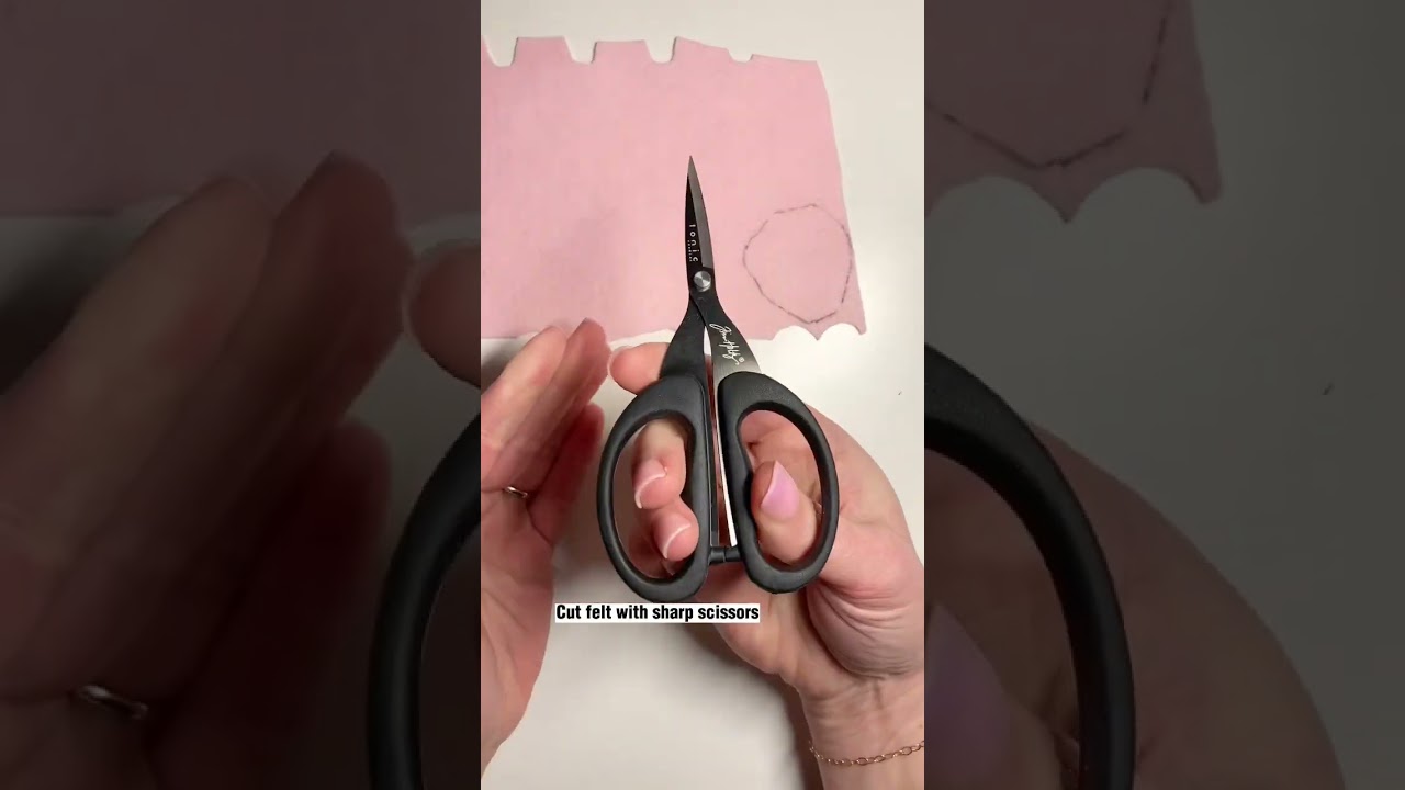 Cutting felt peony petals with a pattern and scissors #feltflower #feltflowertutorial