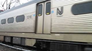 preview picture of video 'New Jersey Transit train along Princeton Junction parking lot'