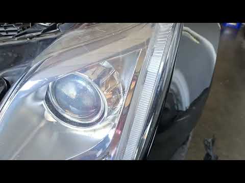 2017 Cadillac XTS: Removing the headlight assembly