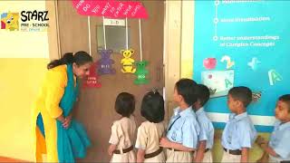 DPSG Teacher greeting her class with special handshakes & hugs before class!