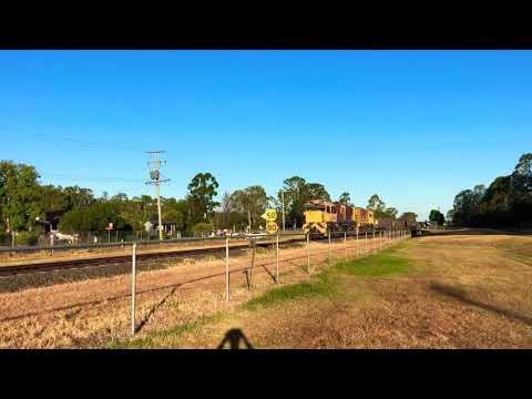 A pair of Aurizon QR2300 locomotives are heading into the sunset