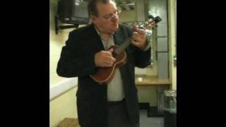 George Hinchliffe of the Ukulele Orchestra of Great Britain backstage at the Albert Hall
