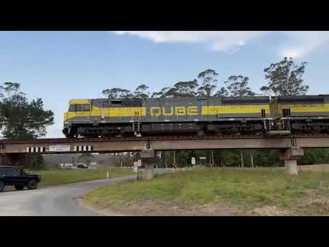 QL003 and QL009 head north with a load of steel past Wauchope on the NSW mid north coast (25/10/23)