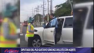 Diputado del PLD Gustavo Sánchez discute con agente de AMET al intentar cruzar intercepción en rojo