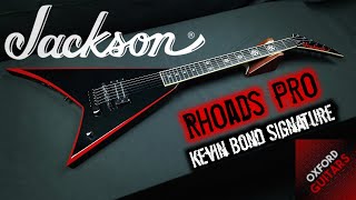Video thumbnail for Jackson Pro Series Kevin Bond Signature Rhoads Black with Blood Red Bevels 4K guitar close up video by Oxford Guitars
