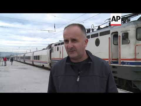 Bosnian police block migrants from disembarking a train