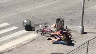 [road rage] Driver and Cyclist fighting in the street. Police break it up.