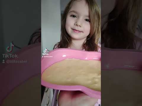 Little girl Lilith makes a unicorn cake