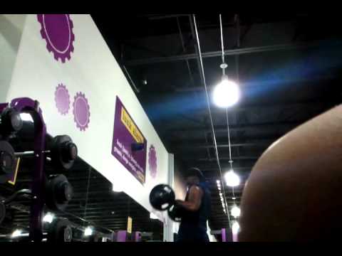 Cocky dude grunting in planet fitness