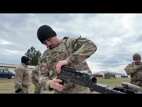 A US Army Soldier Disassembles a M240 Machine Gun