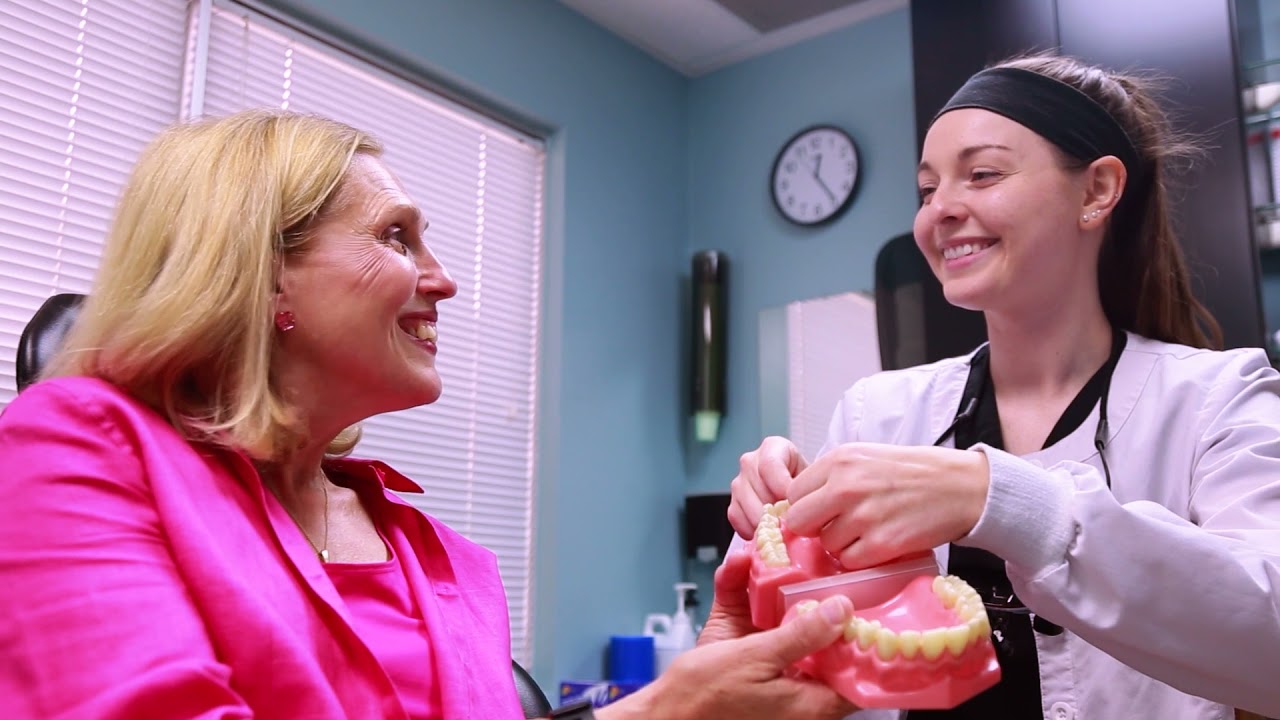 Dentist in Frederick smiling at patient in dental chair