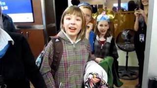 Some adorable flight attendants help these parents surprise their kids with personalized ear hats! Now they can strut down Main Street USA in style!