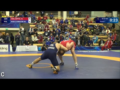 Round 1 GR - 97 kg: M. WIECZORKIEWI (POL) df. B. HOLZAPFEL (GER) by FALL, 4-0