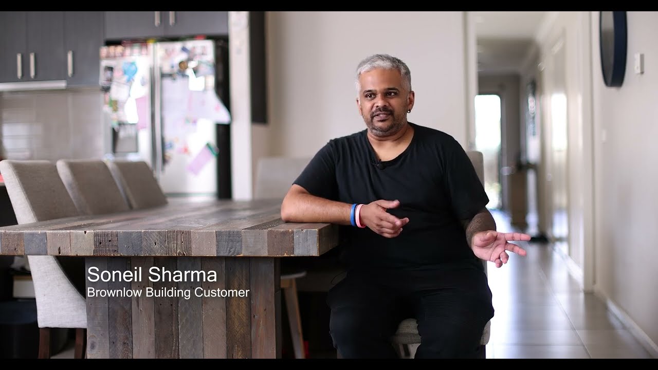 Video thumbnail showing a Brownlow Building client discussing their home renovation experience