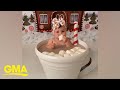 This baby in a cup of hot cocoa is keeping things sweet on Christmas