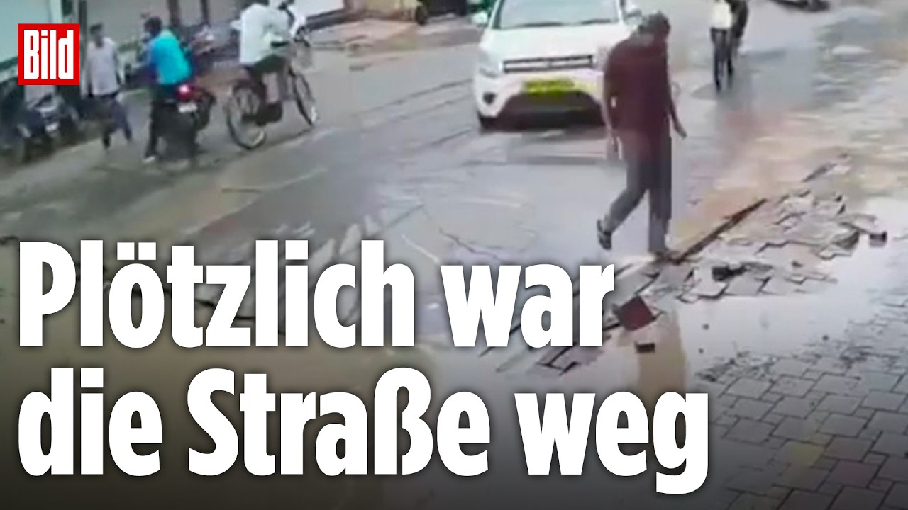 INDIEN: Straße bricht plötzlich ein: Wasserleitung sprengt Fahrbahn